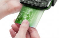 An EMV compliant POS processes a transaction with a chip card.