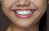 A close up of a girl smiling